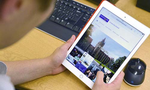 Man looking at brand guidelines on iPad