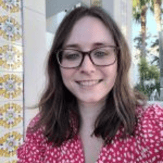 photo of Sam, woman with brown hair and glasses