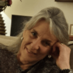 image of Kay - woman with grey long grey hair