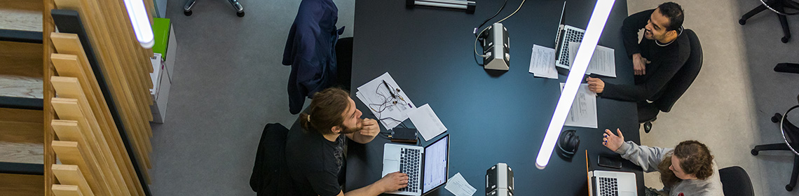University staff using laptops indoors