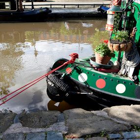 Close up of the front of a barge in a canal 