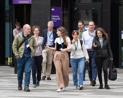 Future Leaders Graduate, Isabel, leading a group tour outside Nancy Rothwell building