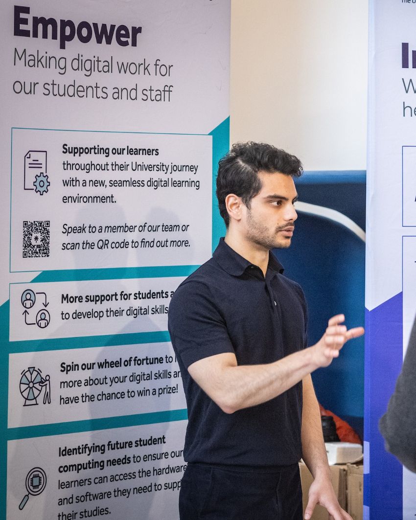 A photo of Yamin, our graduate intern. He has black short hair and wearing a black polo shirt.