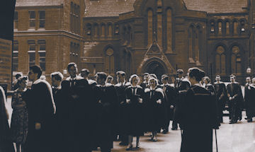 Sepia photo of outside a University building with students walking through the arch way 