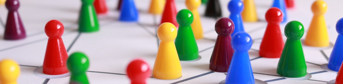 multicoloured pawns on game board