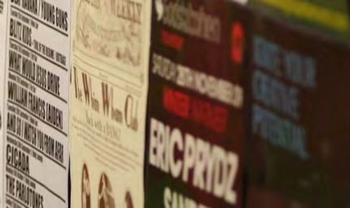 Music concert posters on a wall