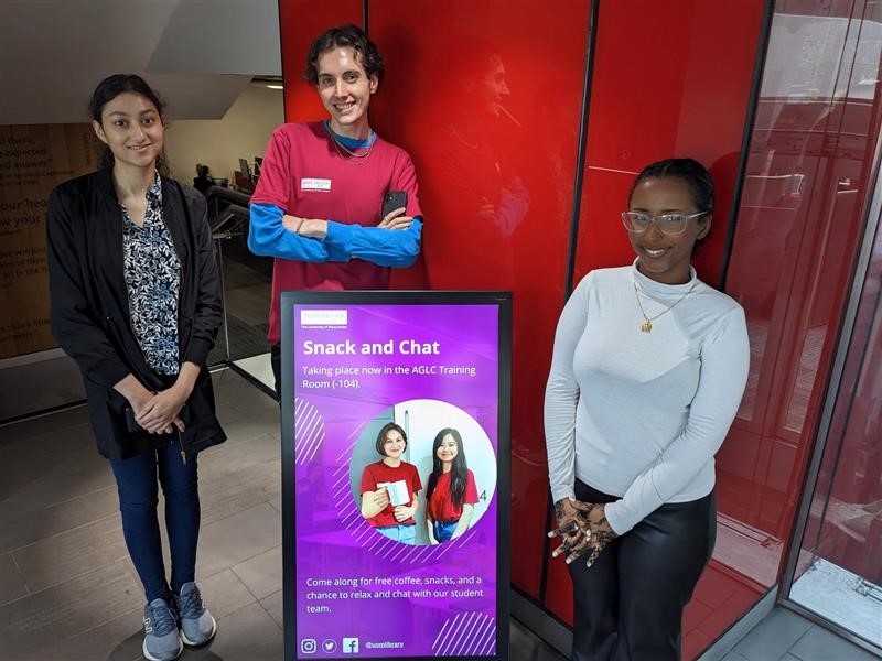 Members of the student team pose with the portable signage device in AGLC