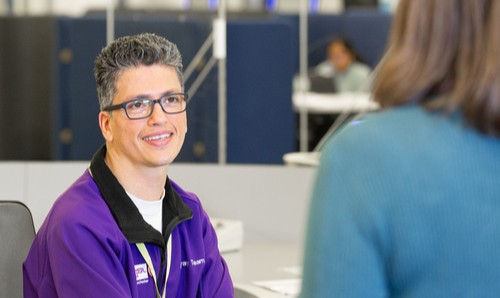 Member of staff smiling at customer