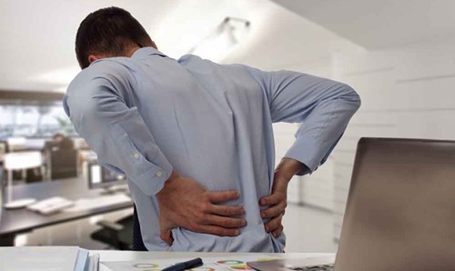 Person holding their back