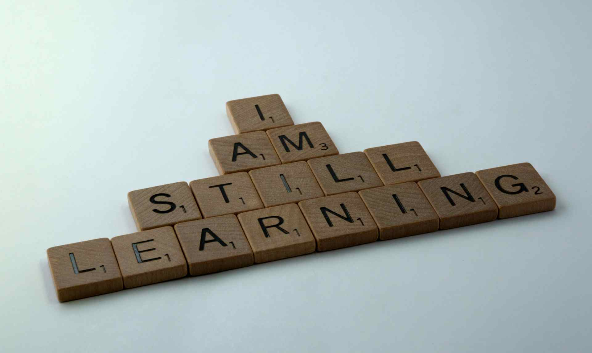 Scrabble tiles that read I am still learning