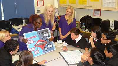 Students from FBMH undertake outreach education in a local school