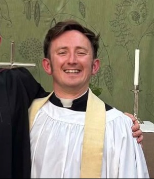 Photo of Joshua Gaskell smiling into the camera