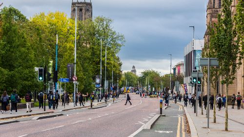 Image of pedestrians walking along Oxford Road campus