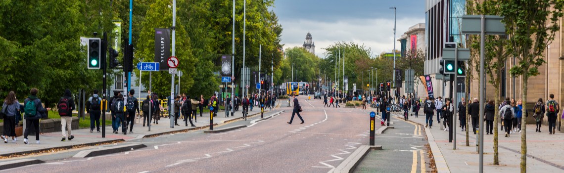 Image of pedestrians walking along Oxford Road campus