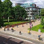 View of Brunswick Park with cyclists and pedestrians 