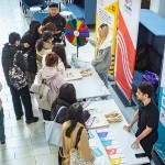 Image of people at pop up information stands