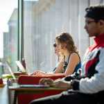 People at laptop desk