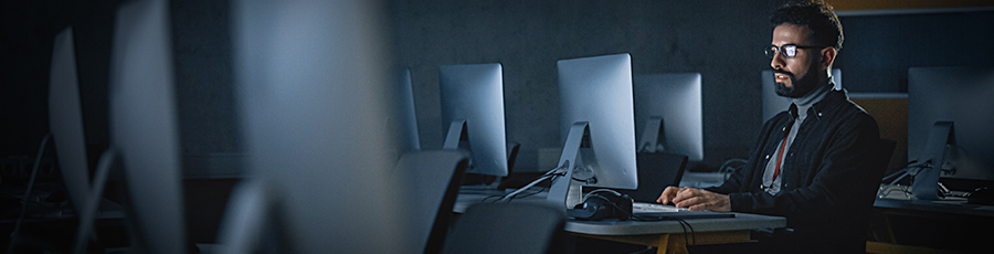Image: Man in classroom using a computer