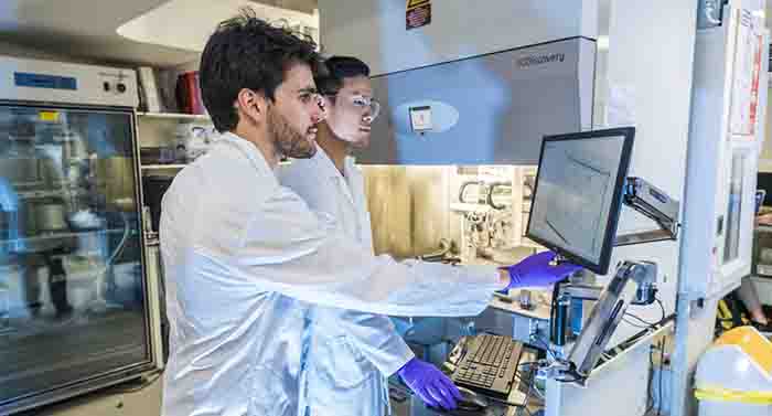 PhD students working on the 3D cell printer at The University of Manchster