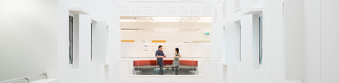 People talking in building atrium