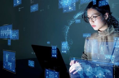 A woman using a laptop accessing data
