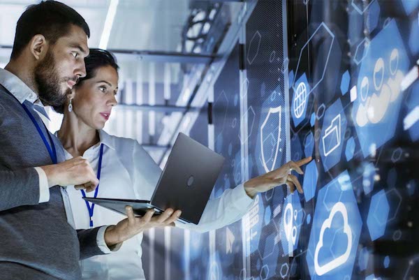 Two technicians explore the different types of technical systems used - collaboration, cloud, storage