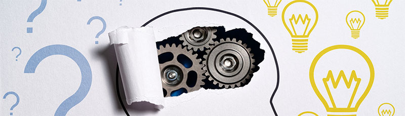 A representative illustration of a persons head with paper ripped over the mind revealing cogs whirling 