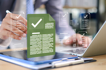 A computer generated image showing a man on a laptop checking a document is accessible