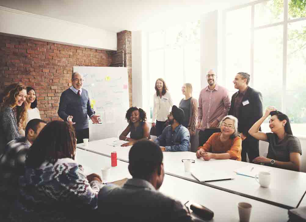 Leader talking to a room of people