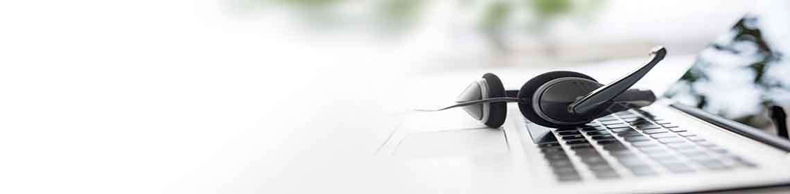 An open laptop with headphones