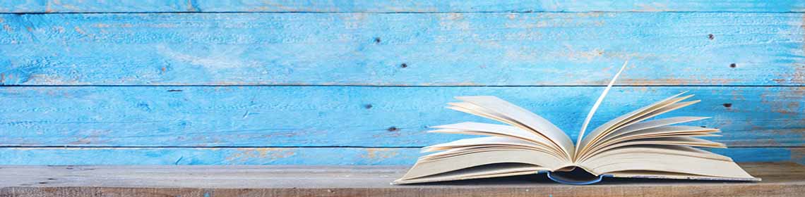 An open book against a blue background