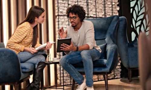 Image of professionals having a work conversation