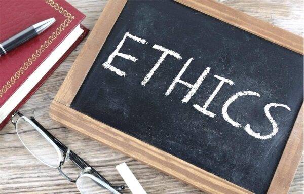 Whiteboard with 'Ethics' on it.