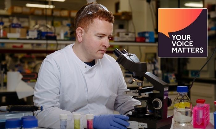 Man working with microscope